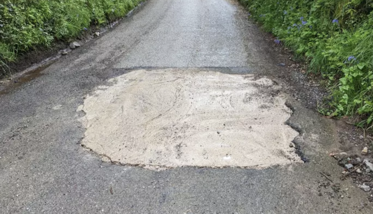 A Hero in a Car Takes on the Pothole Problem