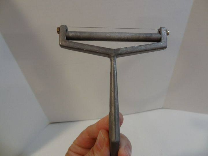 Unveiling the Vintage Presto Aluminum Cheese Slicer